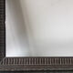 Antique wooden frame with geometric carvings light distress