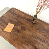 Modernist coffee table in solid elm, cylindrical pine base, 1970s.