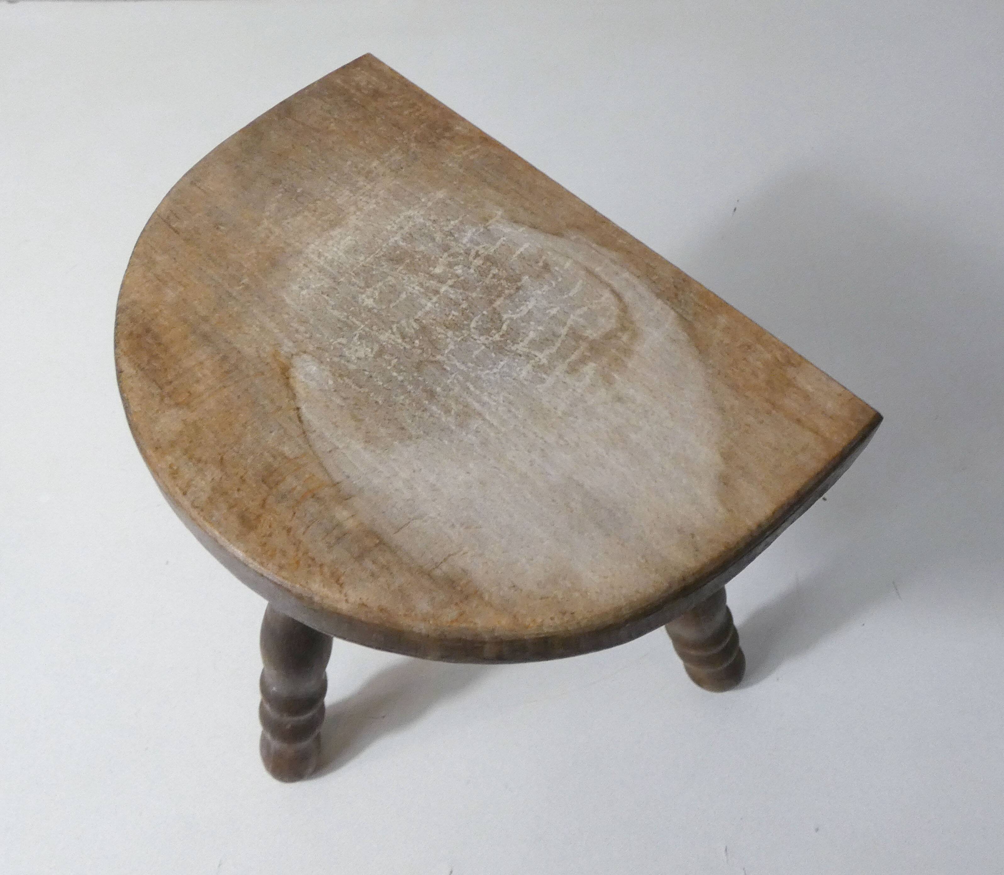 Old milking bench tripod stool in solid wood