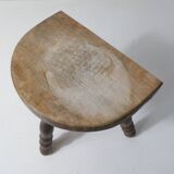 Old milking bench tripod stool in solid wood