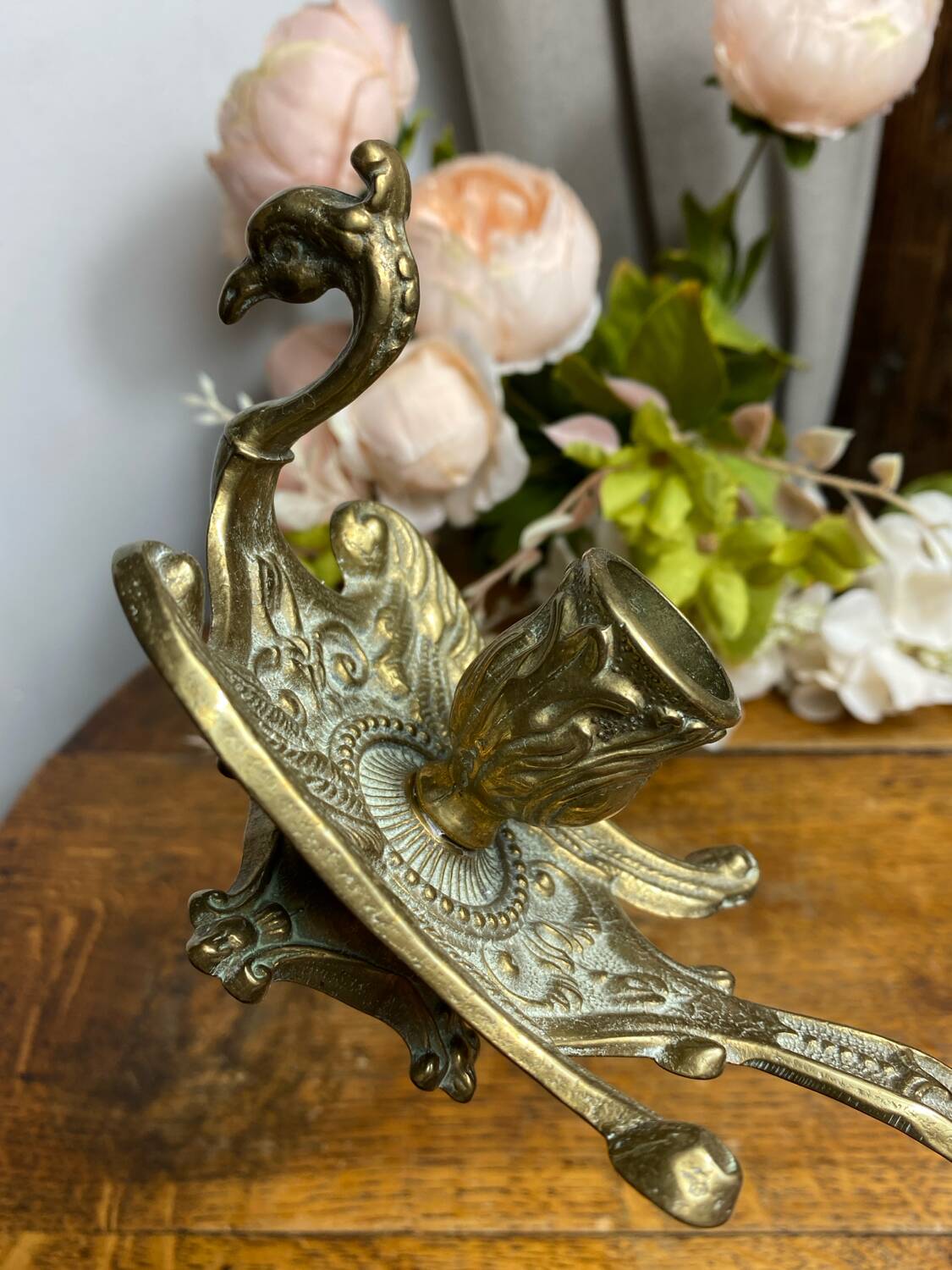 Hand candlestick, peacock shape, in bronze