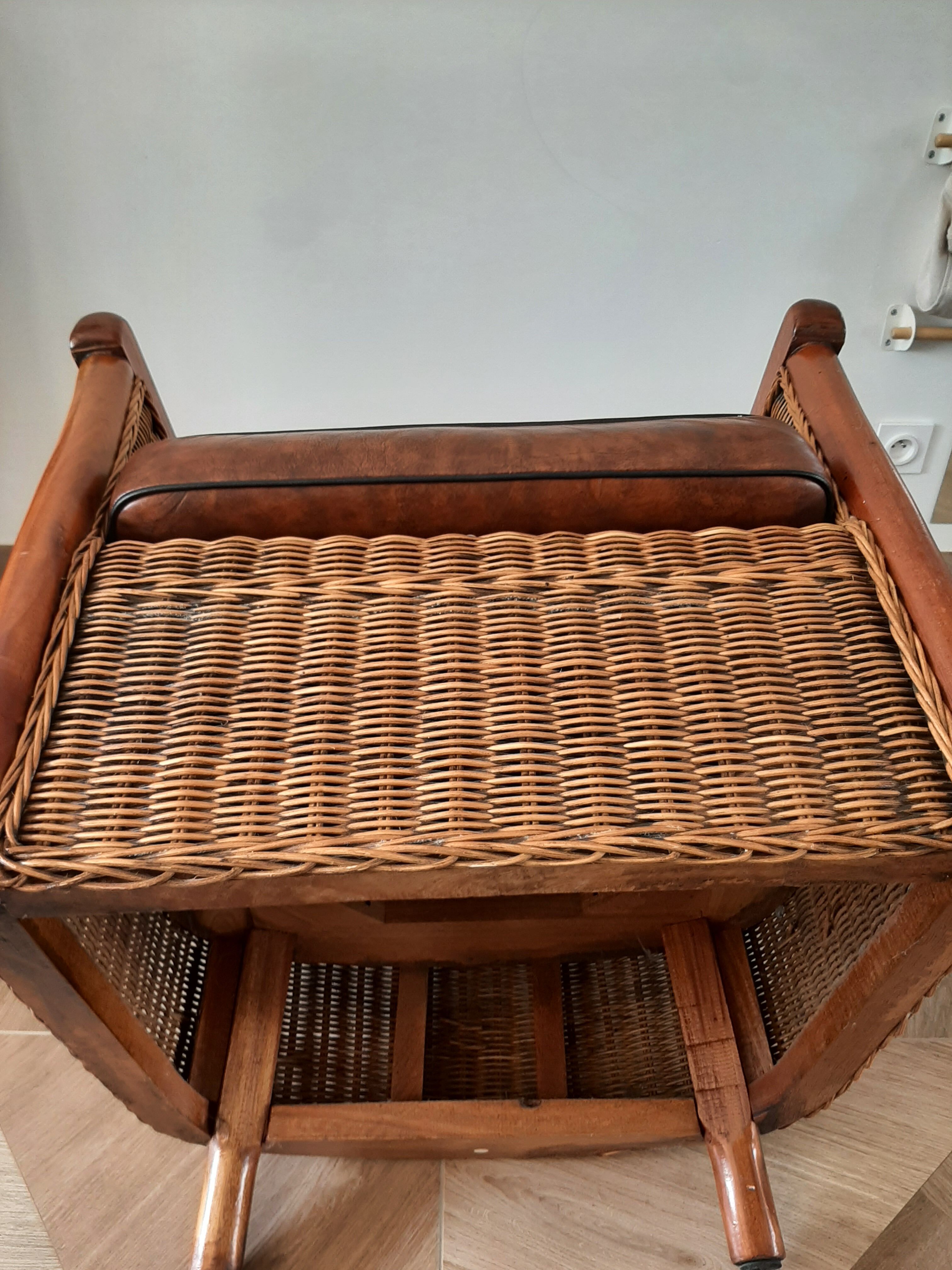 Armchair in woven rattan and exotic wood