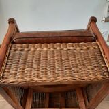 Armchair in woven rattan and exotic wood