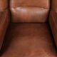 Large sheepskin wingback armchair in timeless English style