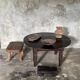 Antique round coffee table in Indonesian teak with turned legs.