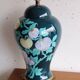 Vintage ceramic lamp with floral decoration.