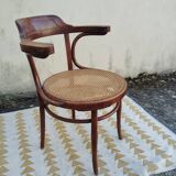 Caned chair with armrests attributed to Fischel
