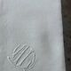 4 serviettes en lin teintées jaune pastel, monogrammées AL