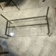 Table basse double plateaux en acier et bronze ainsi que verre