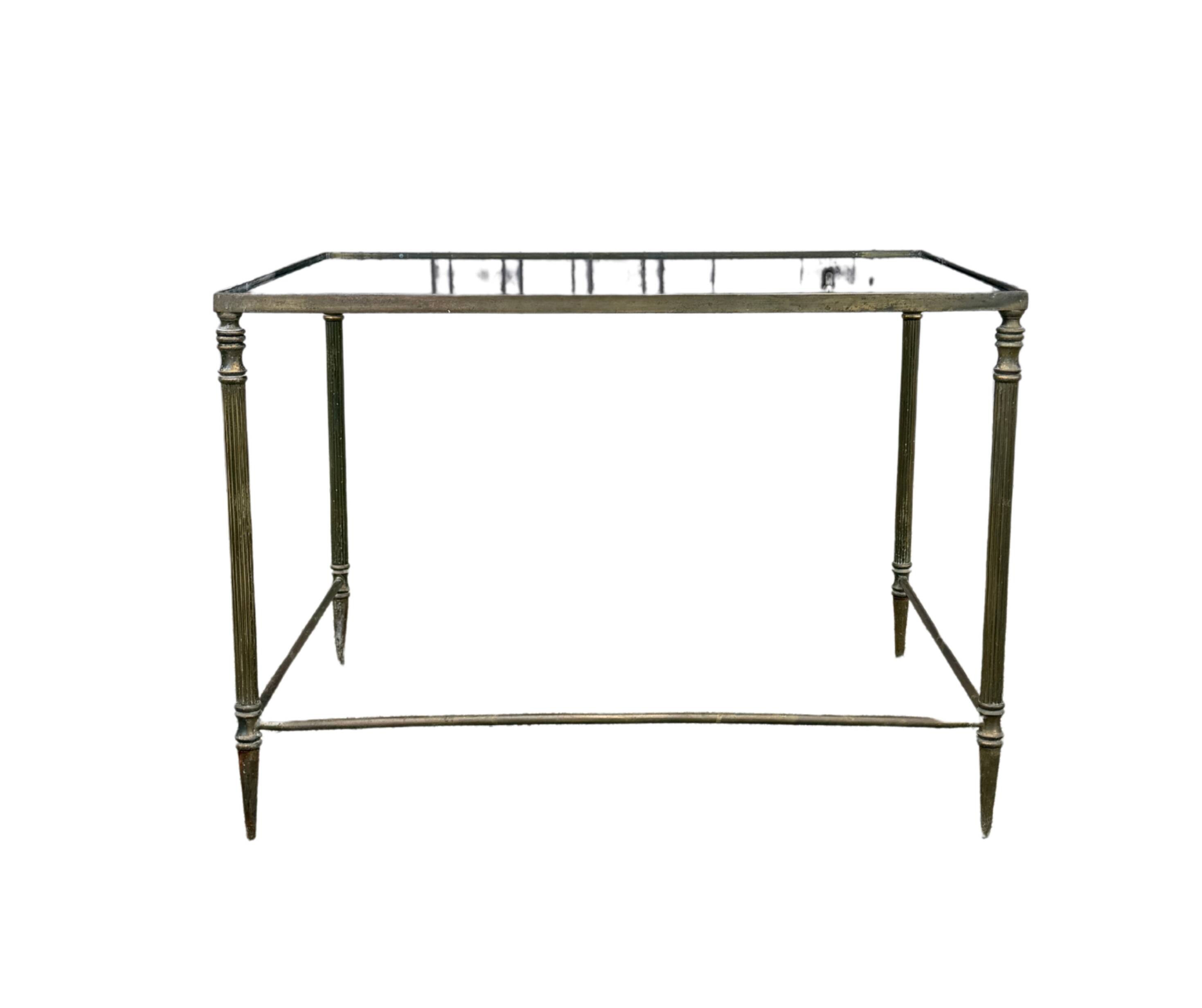 Side table in brass and smoked glass