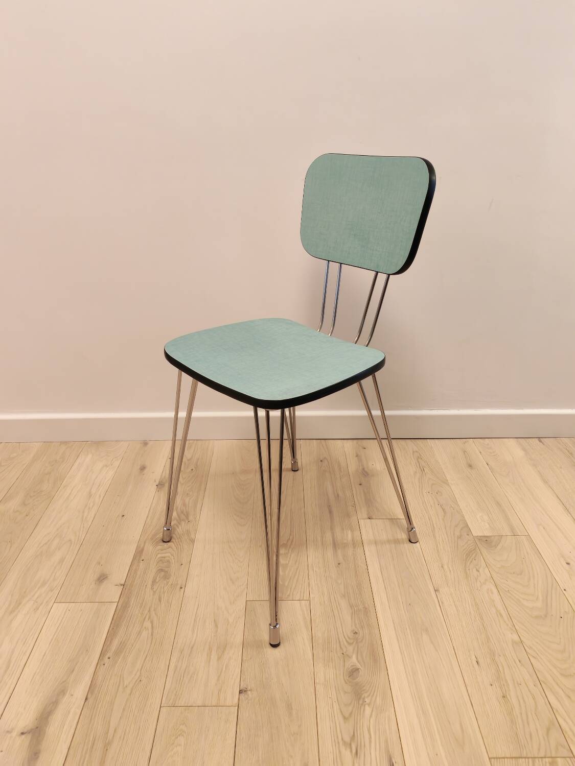 Pair of green Formica chairs with Eiffel legs