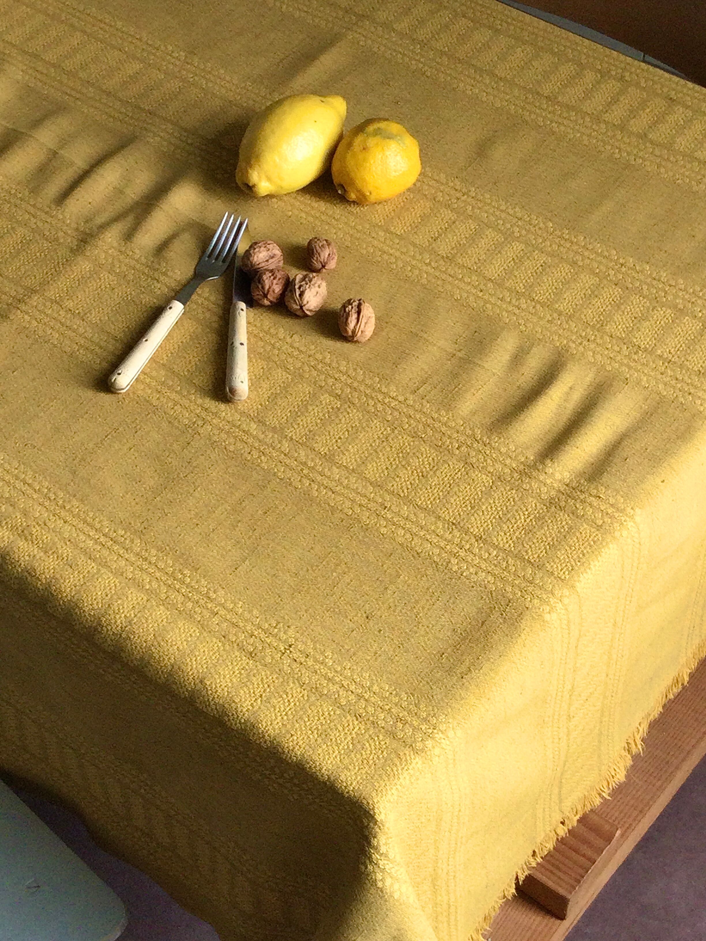 Old damask tablecloth tinted curry yellow