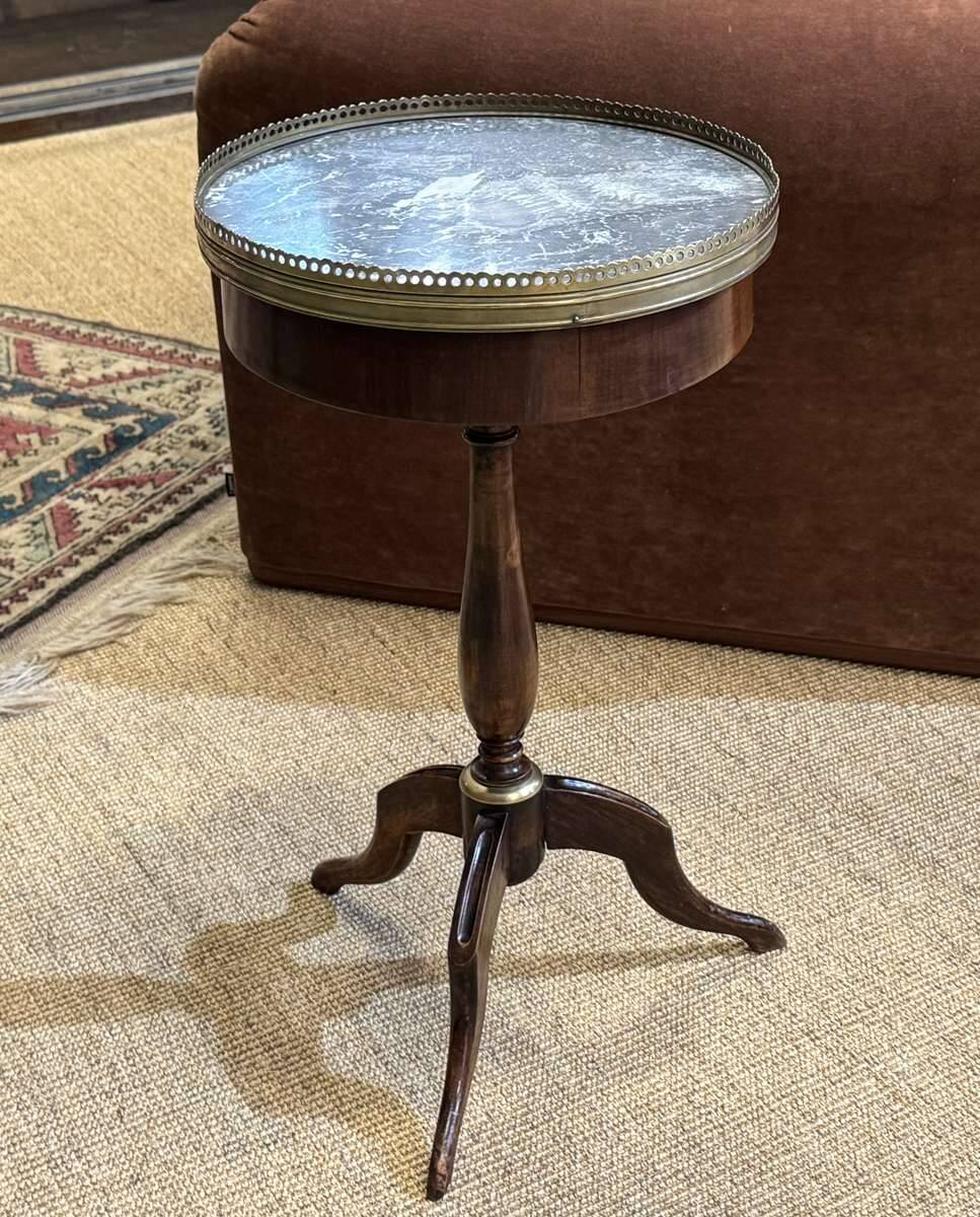 Mahogany gueridon with marble top from the 1950s.