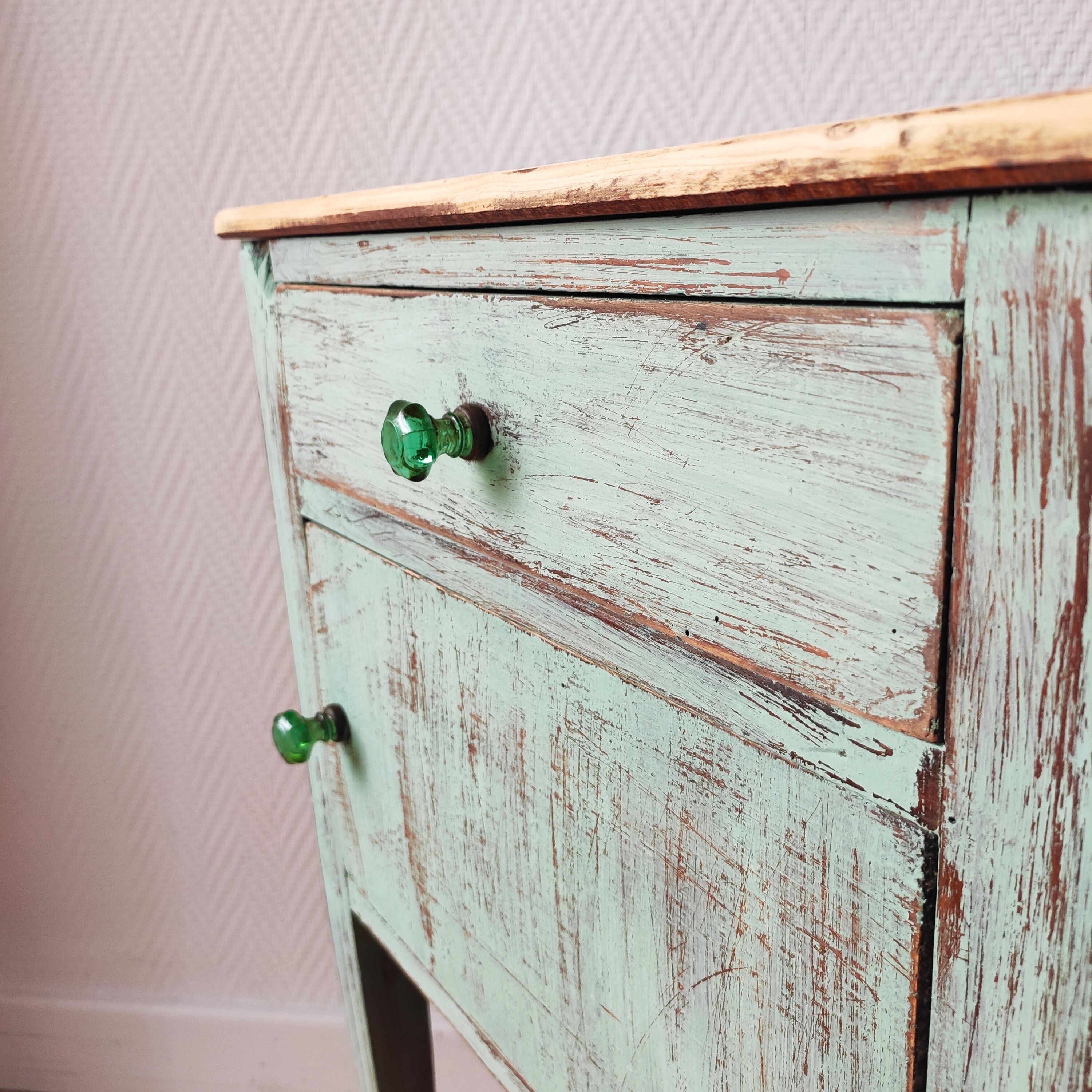 Patinated bedside table end of sofa