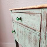 Patinated bedside table end of sofa