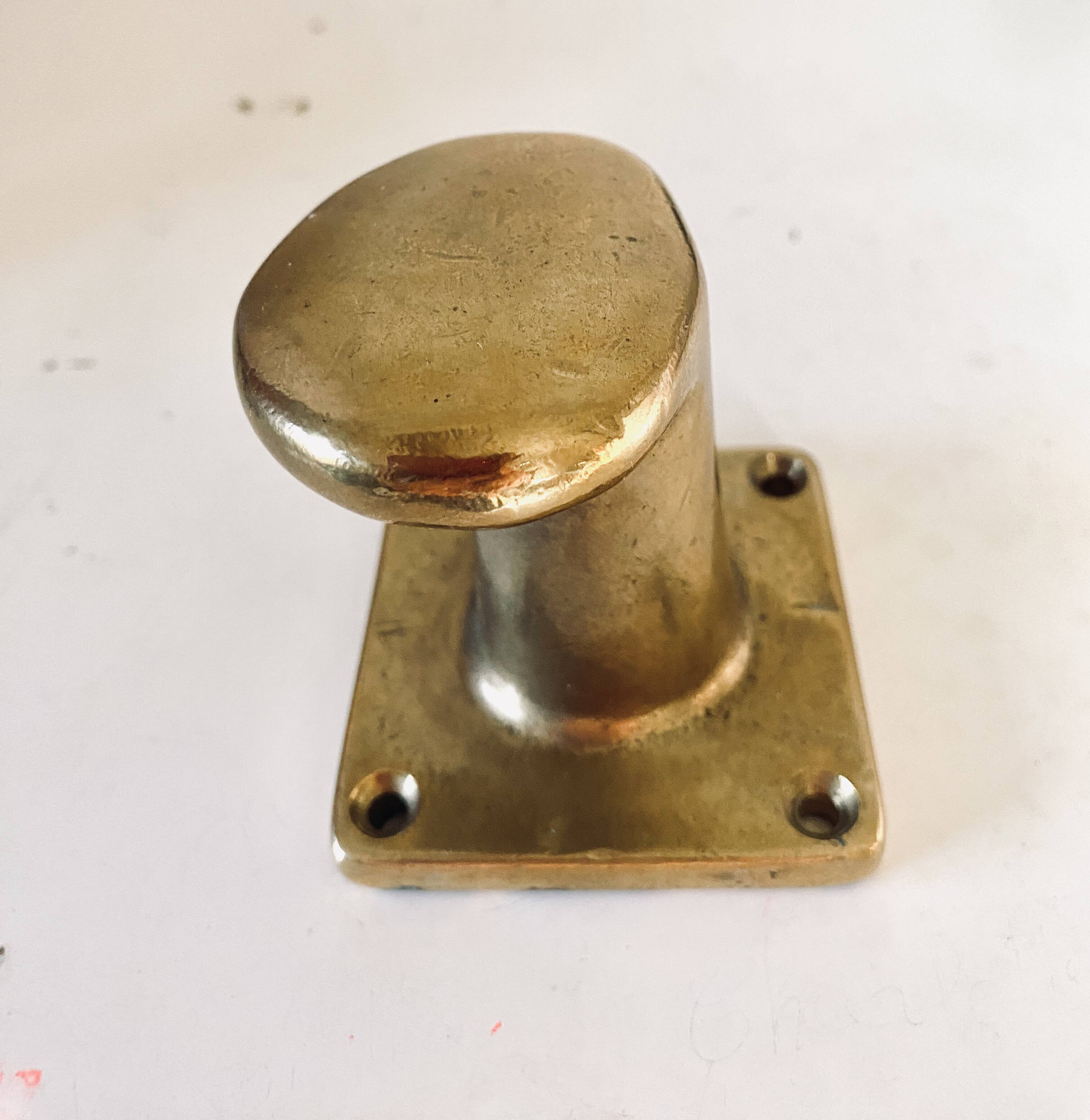 Pair of golden cast iron hooks