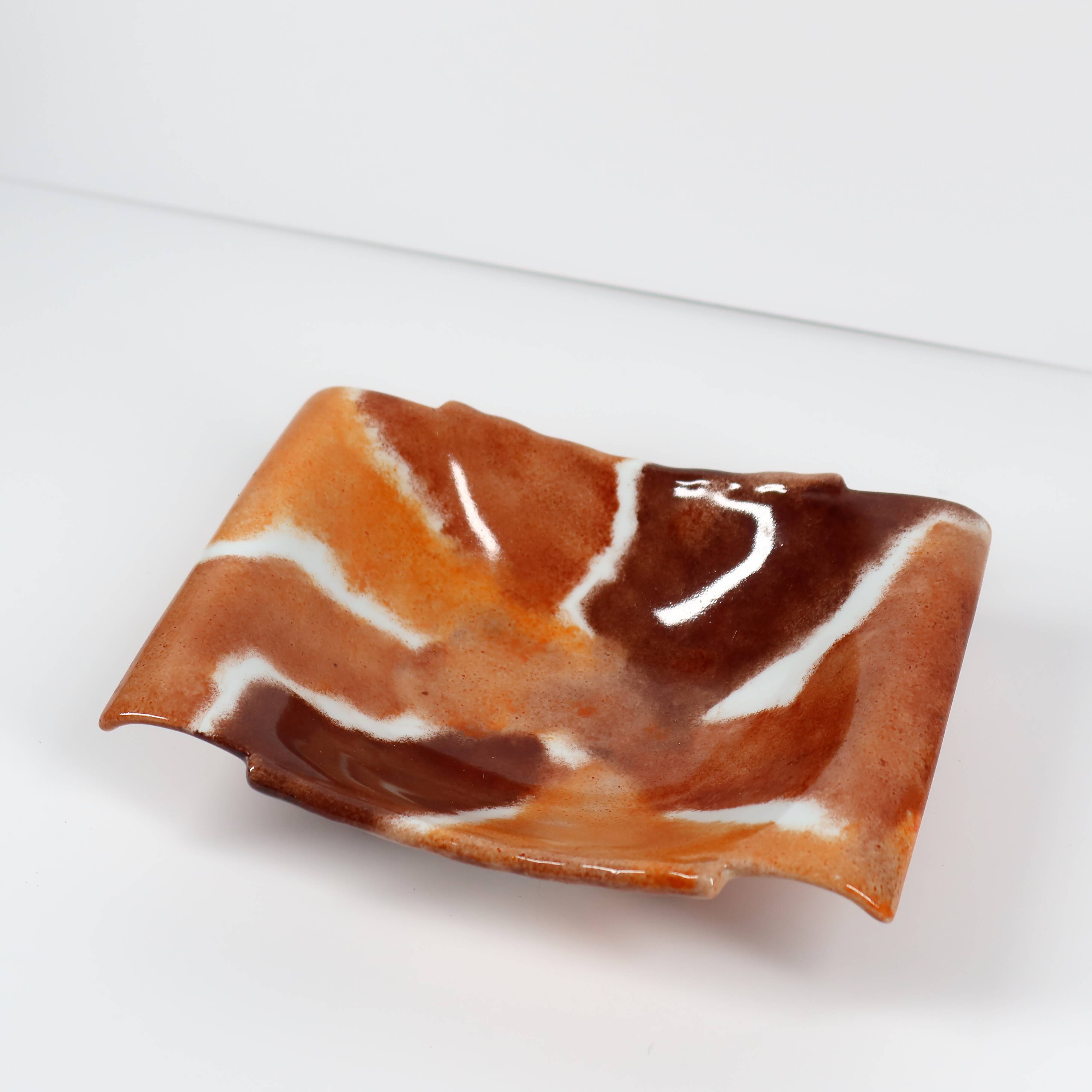Handcrafted ceramic trinket dish in shades of brown and orange
