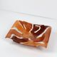 Handcrafted ceramic trinket dish in shades of brown and orange