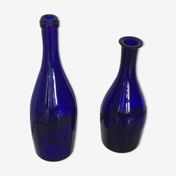 Series of two blue glass bottles