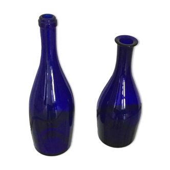 Series of two blue glass bottles