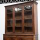 Large glass-fronted library in rosewood from the 19th century.