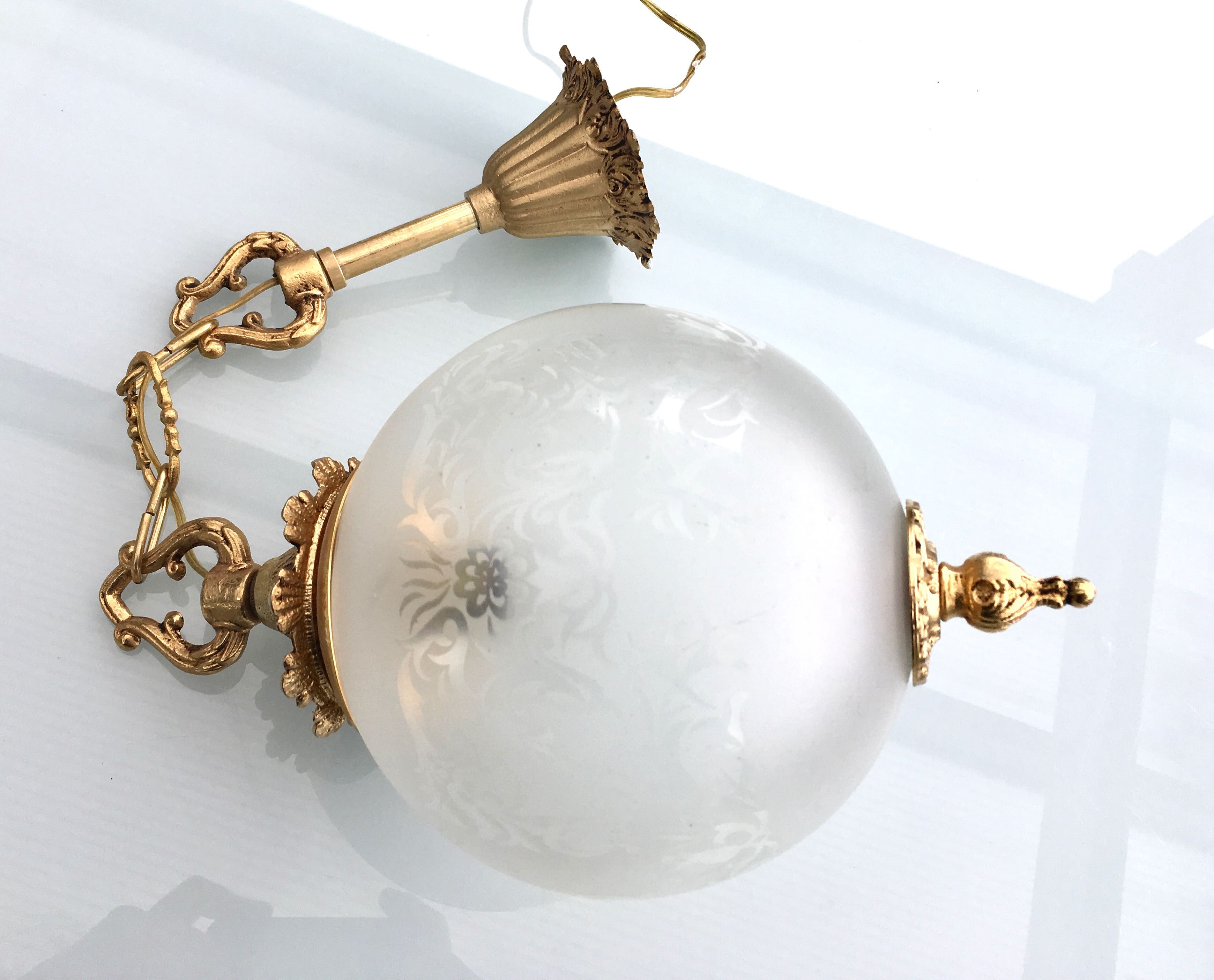 Floral globe and gold metal hanging lamp