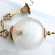 Floral globe and gold metal hanging lamp