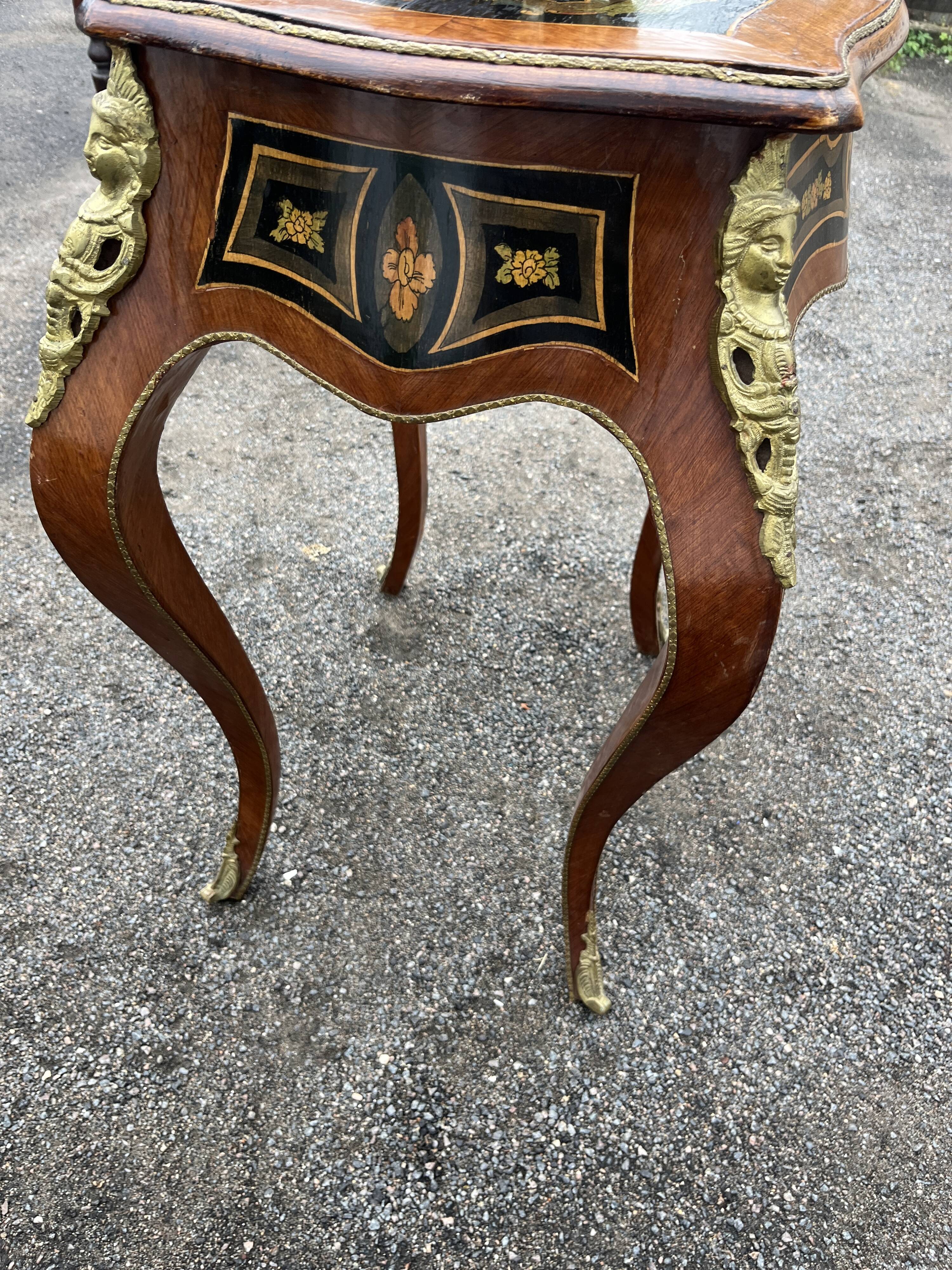Louis XV style side table with marquetry and gilded bronze.
