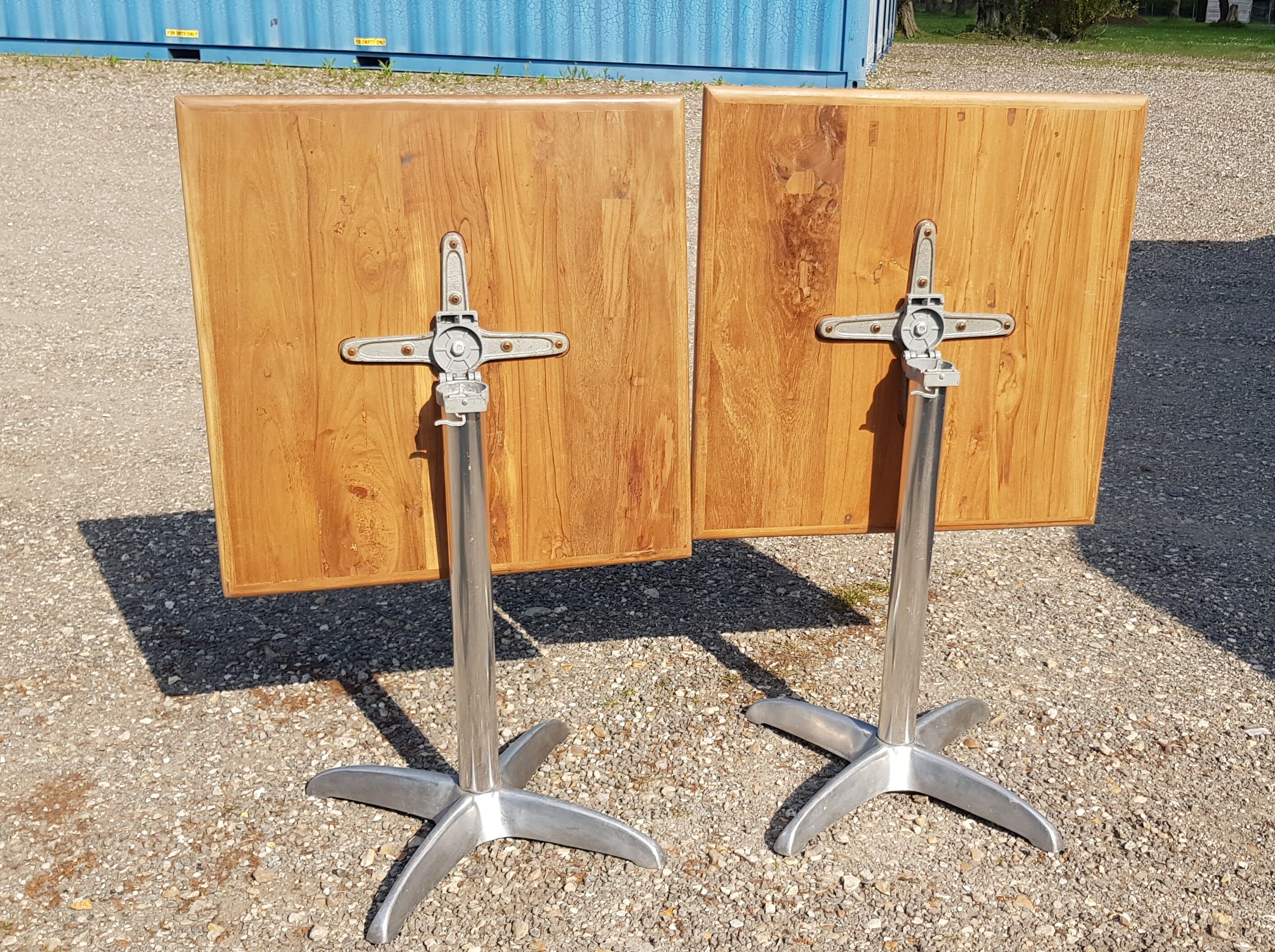 Foldable bistro table with teak top and aluminum base