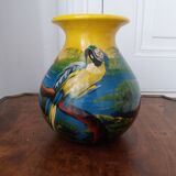 Mexican popular art vase decorated with parrots and toucans.