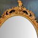 Beautiful Baroque Style Oval Decorative Mirror - Gilded with gold leaf with a Beautiful Patina