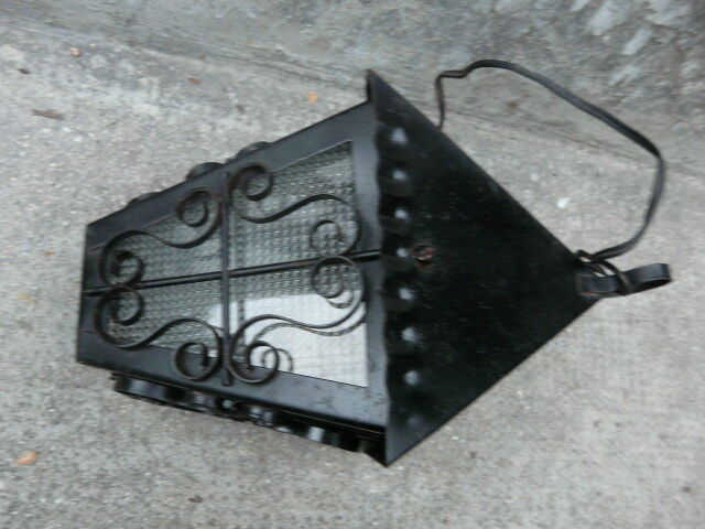 pair of wrought iron lanterns and granite glass