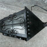 pair of wrought iron lanterns and granite glass