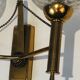 Pair of brass wall lights with glass globes. Around 1970.