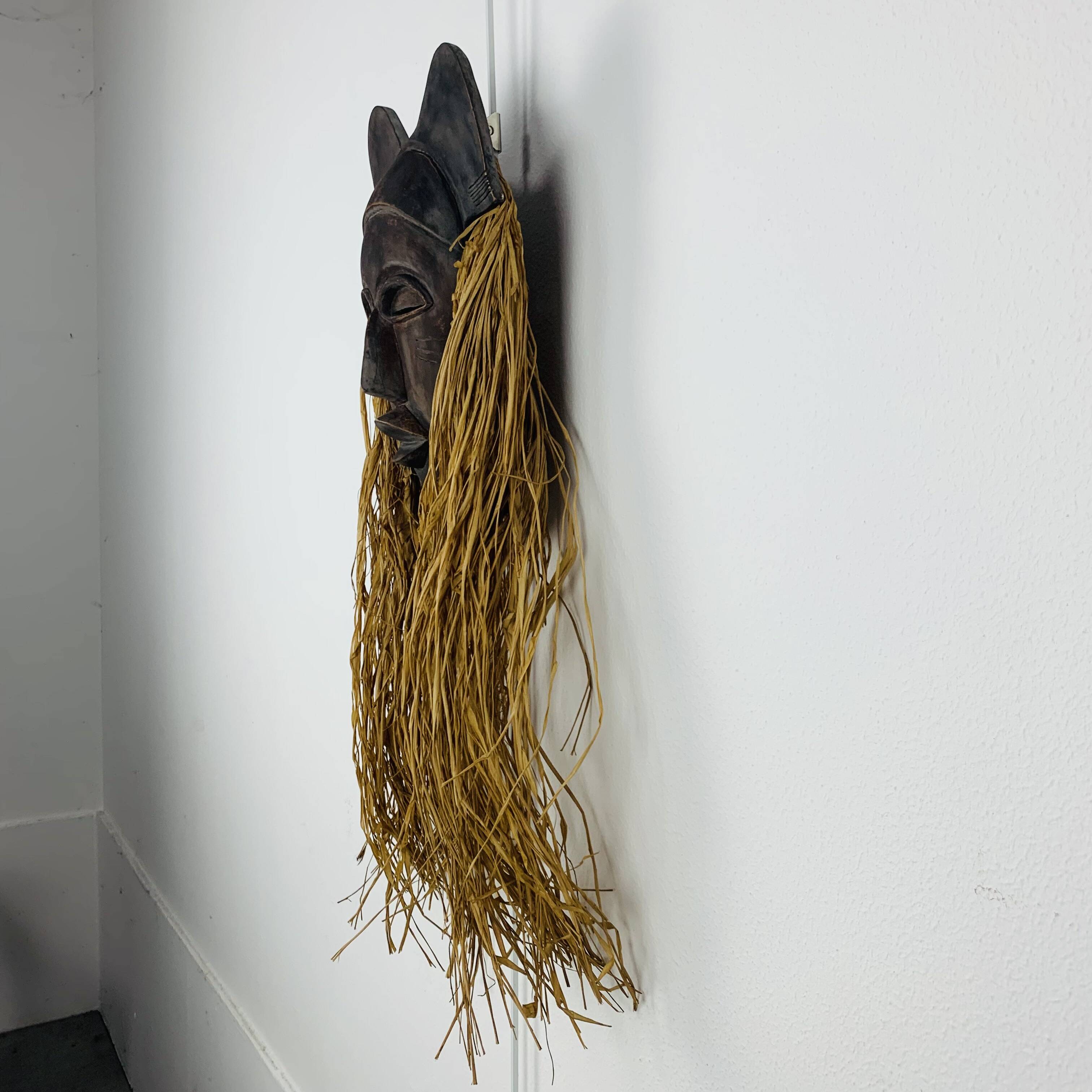 African ceramic and raffia mask signed BJ