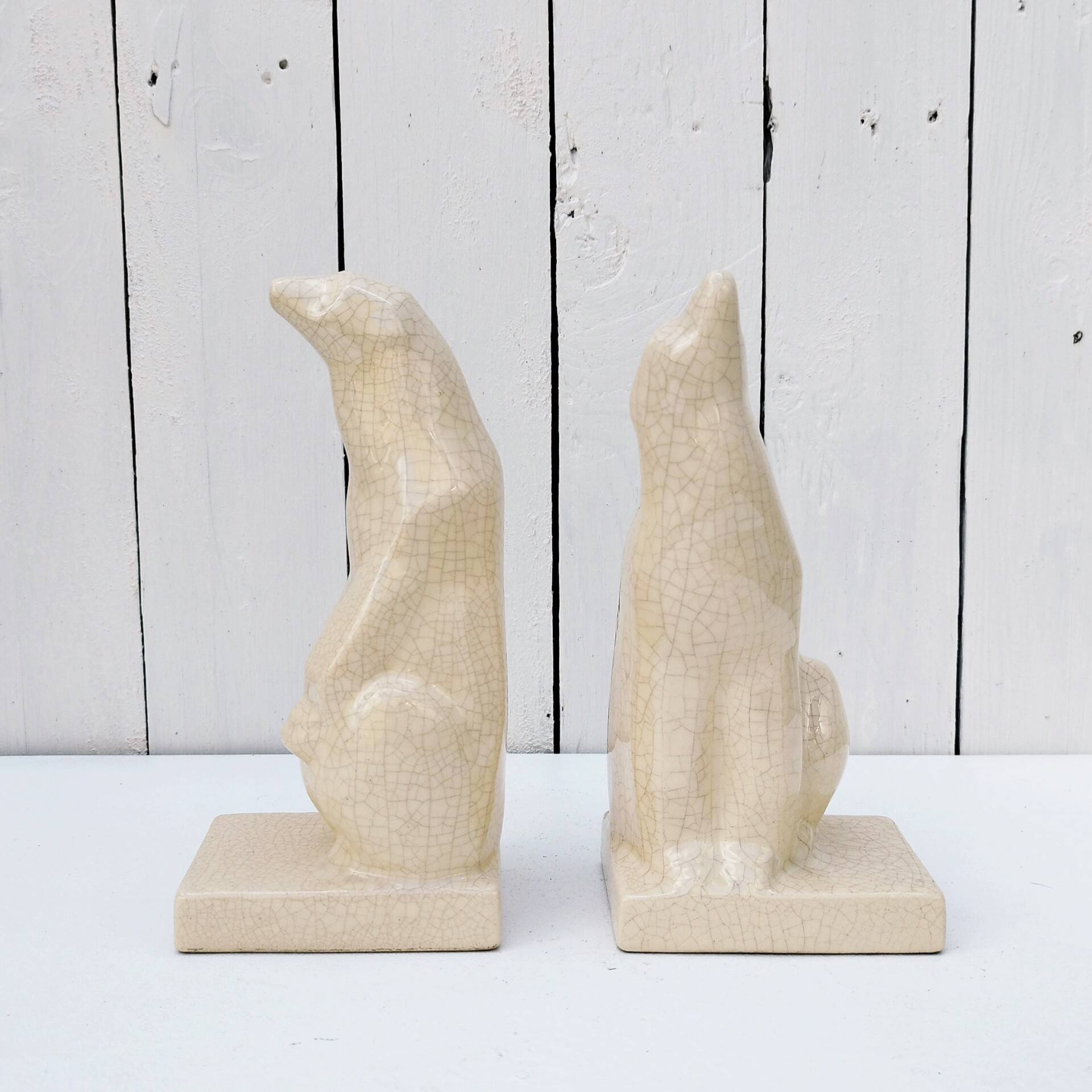 Cracked ceramic bookends with a couple of bears