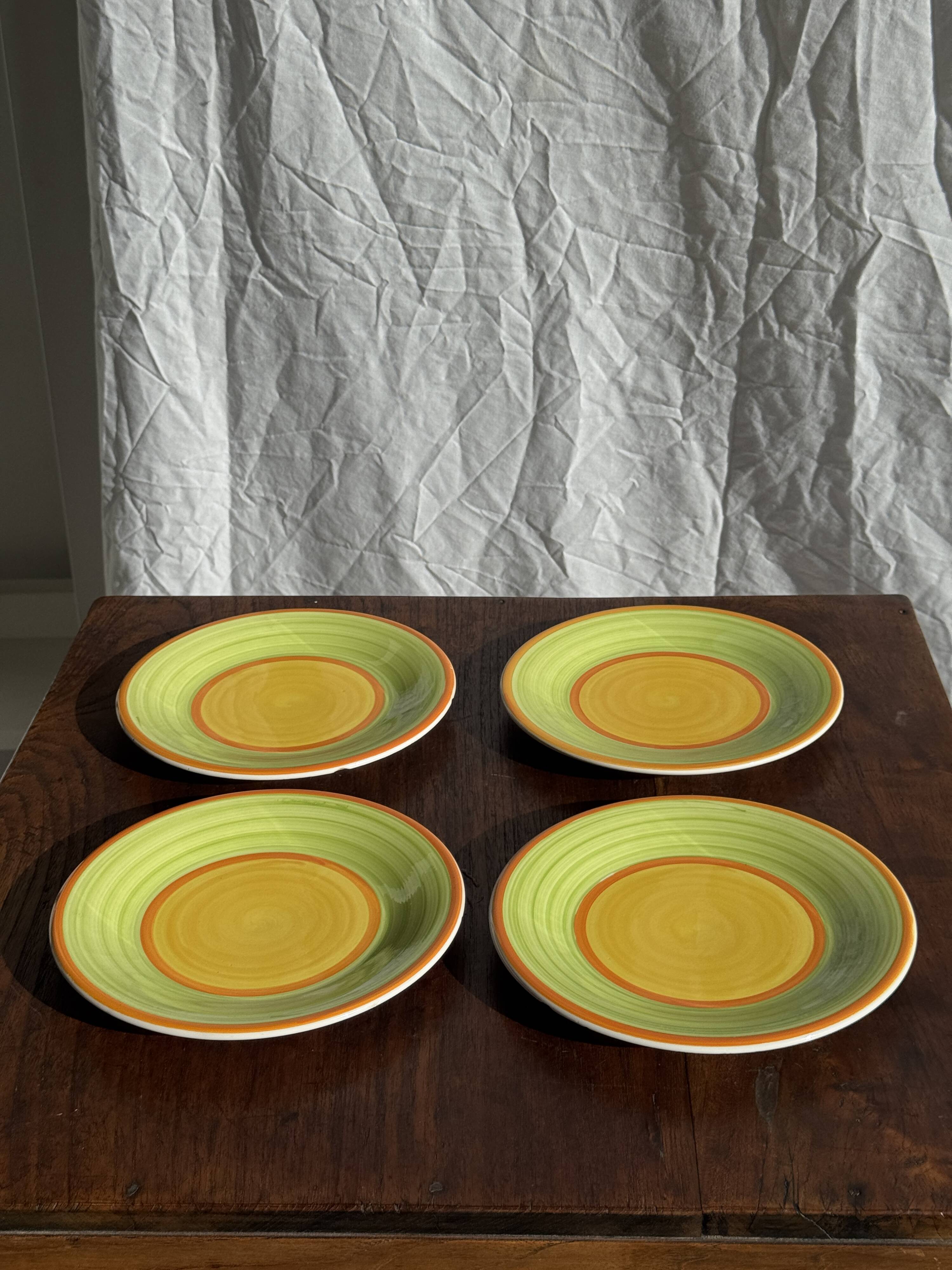 Set of 4 Italian ceramic plates in green, orange, and yellow splashes D20.