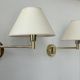 Pair of vintage adjustable wall lights, brass and beige fabric, France, 1970