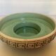 Green ceramic candle holder with a frieze