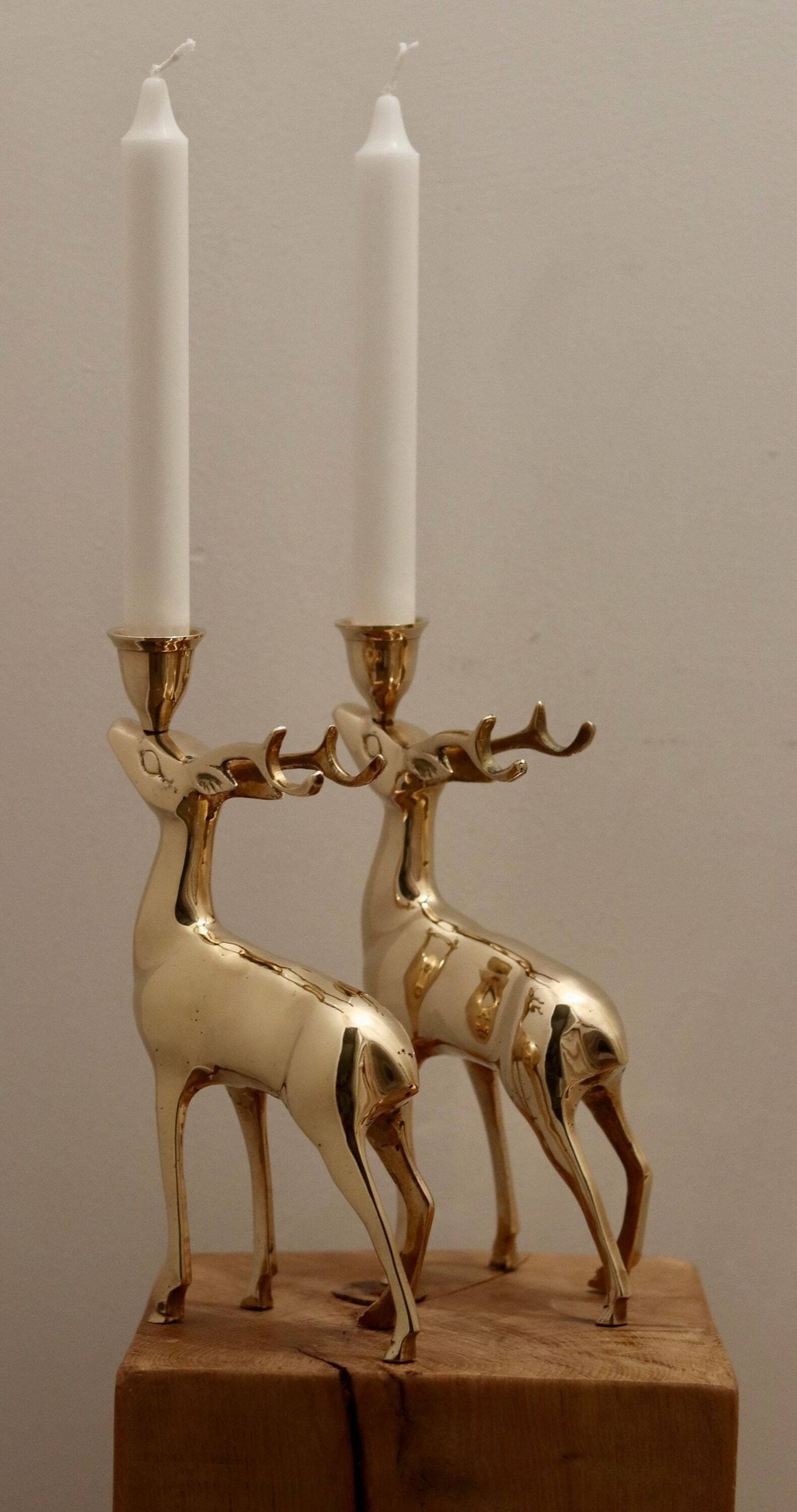 Pair of brass candle holders in the shape of deer from the mid-century.