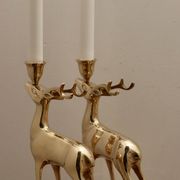 Pair of brass candle holders in the shape of deer from the mid-century.