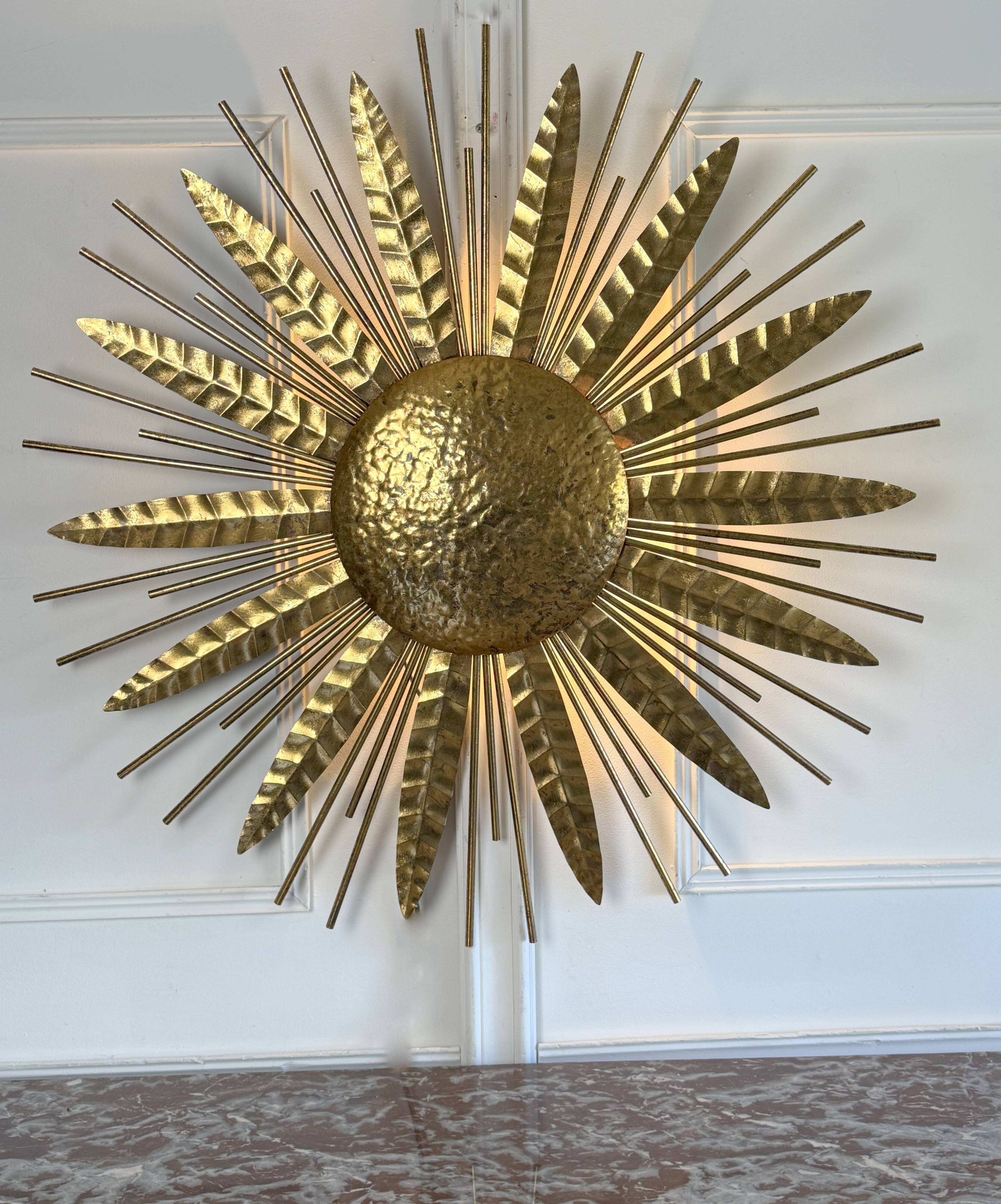 Large golden hammered metal sun wall light with a diameter of 90 cm from the year