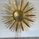 Large golden hammered metal sun wall light with a diameter of 90 cm from the year