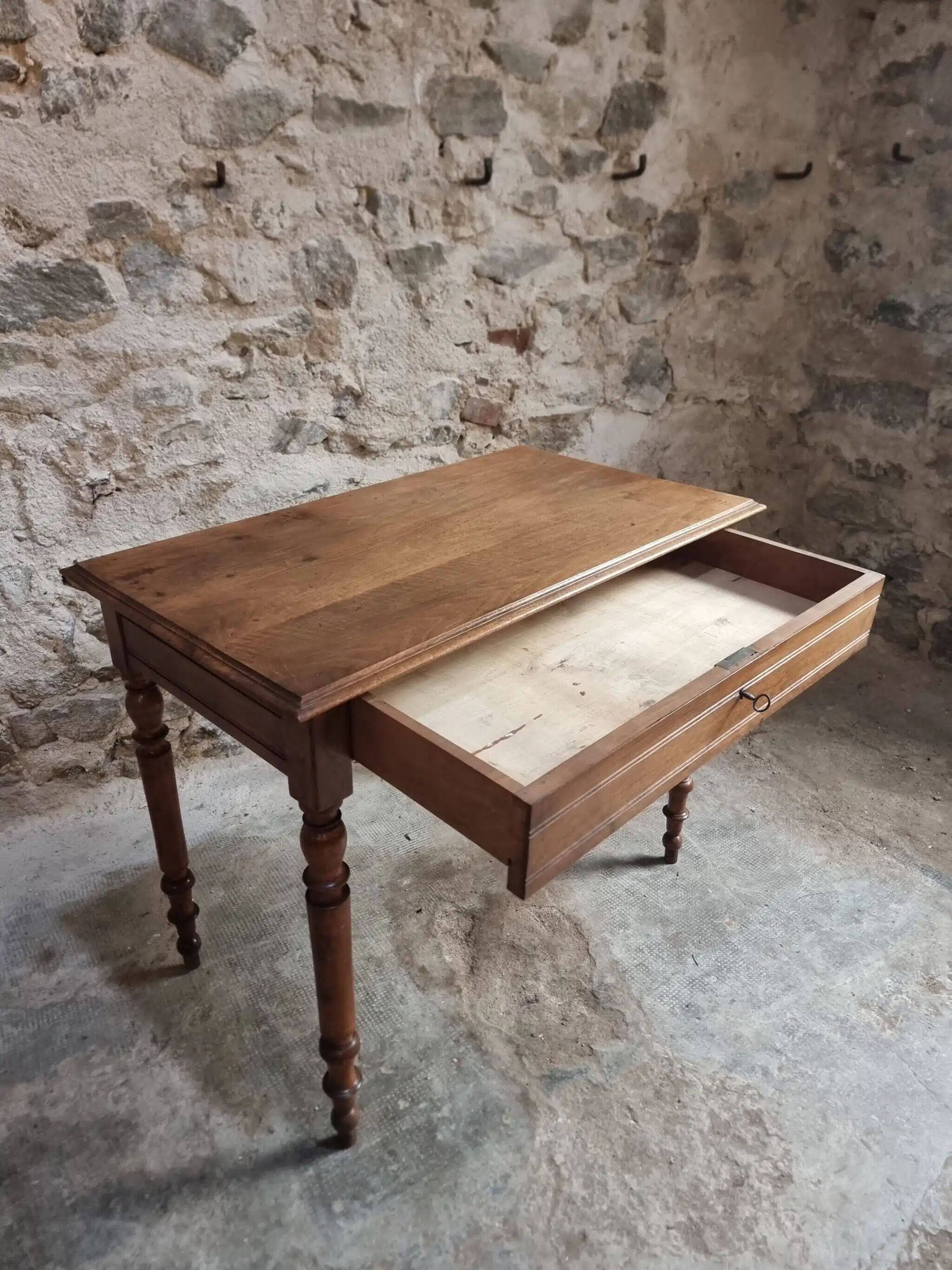Antique French writing table in walnut with a drawer, circa 1900.