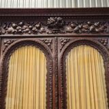 Two-body buffet in solid oak, richly carved in the Renaissance style.