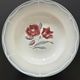 Set of 2 antique deep plates with red flower pattern.