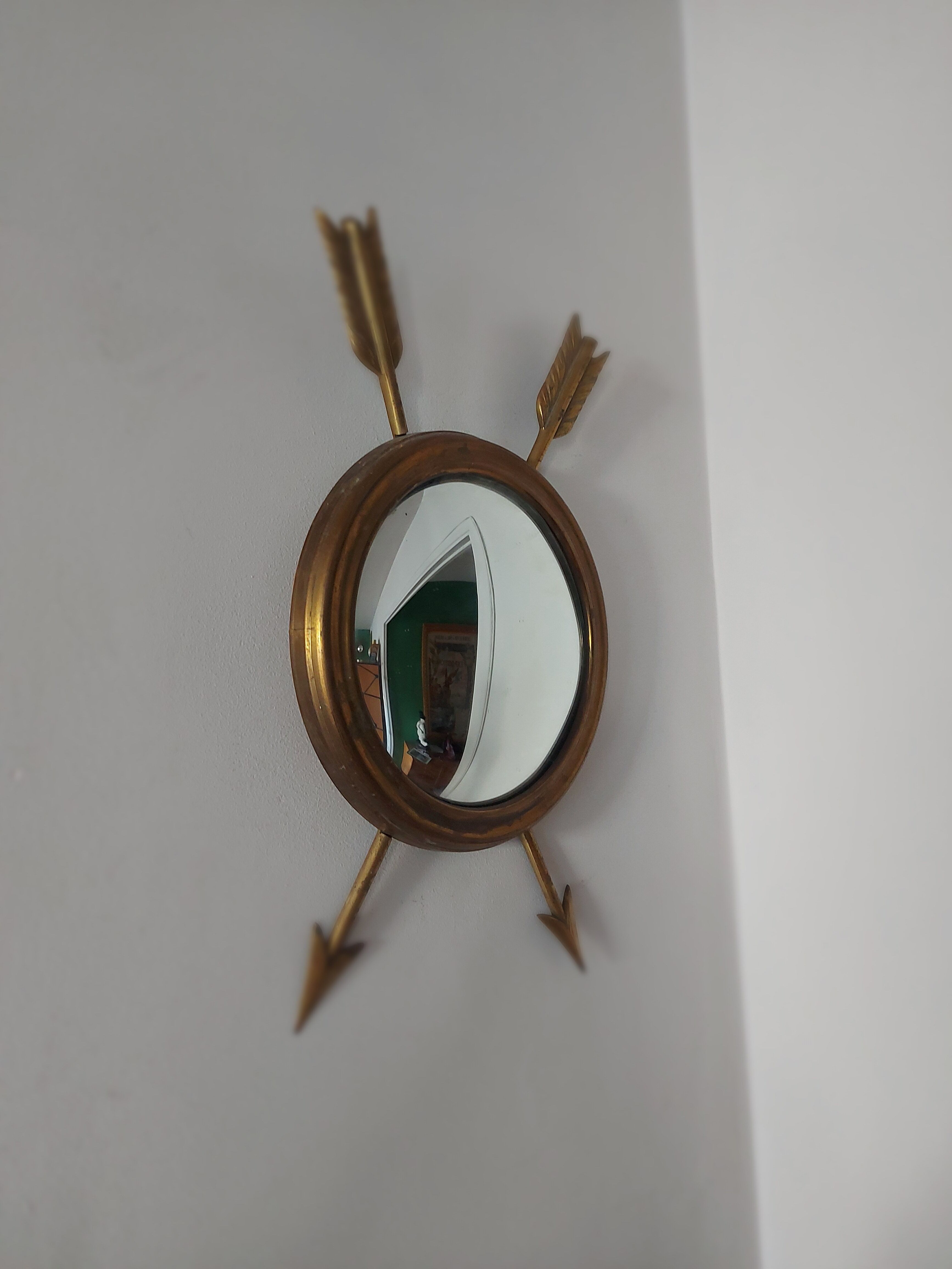 Curved brass witch's mirror