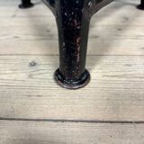 Unmarked black Rowac stool with a dark wood seat.