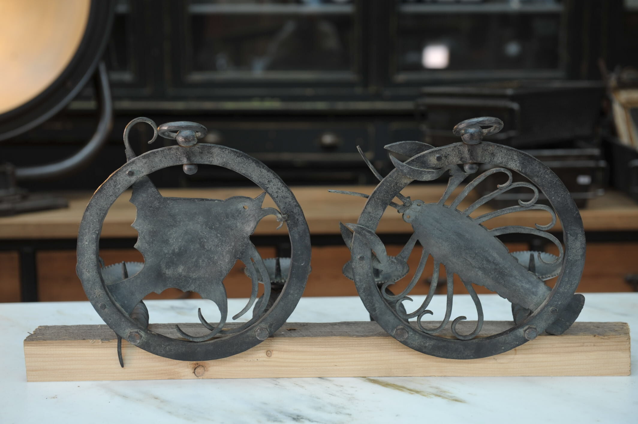 Pair of carved metal wall lamps signed RG