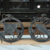 Pair of carved metal wall lamps signed RG